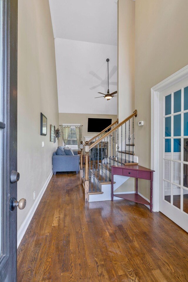 2122 Slater Dr, Murfreesboro, TN 37128 - entrance foyer featuring a high ceiling, a ceiling fan, stairway, wood finished floors, and baseboards