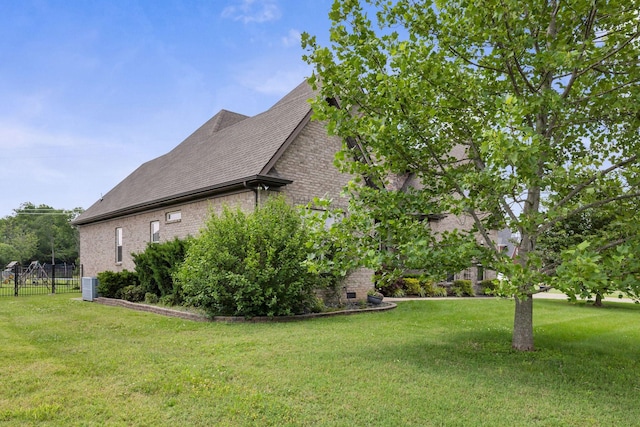 2122 Slater Dr, Murfreesboro, TN 37128 - view of side of home with brick siding, central AC unit, and roof with shingles