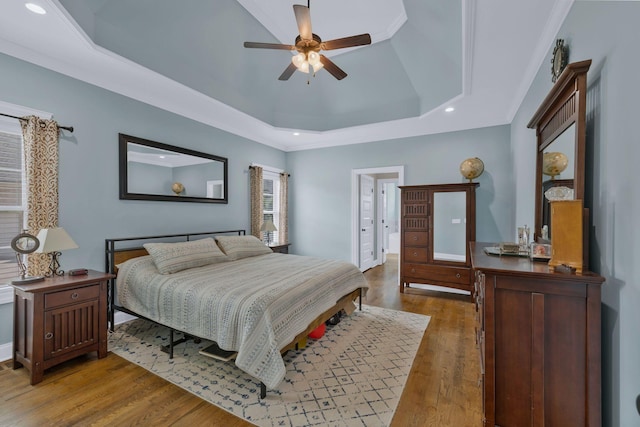 2122 Slater Dr, Murfreesboro, TN 37128 - bedroom featuring recessed lighting, a tray ceiling, wood finished floors, and ceiling fan