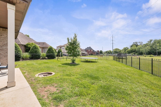 2122 Slater Dr, Murfreesboro, TN 37128 - view of yard featuring a trampoline and an outdoor fire pit