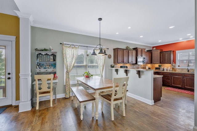 2122 Slater Dr, Murfreesboro, TN 37128 - dining room featuring plenty of natural light, wood finished floors, crown molding, recessed lighting, and baseboards