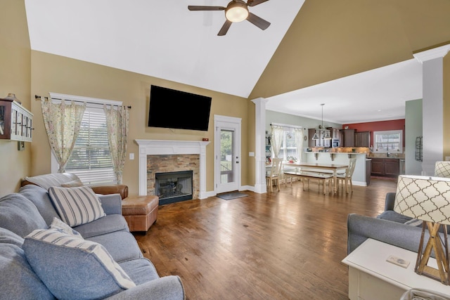 2122 Slater Dr, Murfreesboro, TN 37128 - living room featuring a ceiling fan, high vaulted ceiling, a stone fireplace, dark wood-type flooring, and baseboards