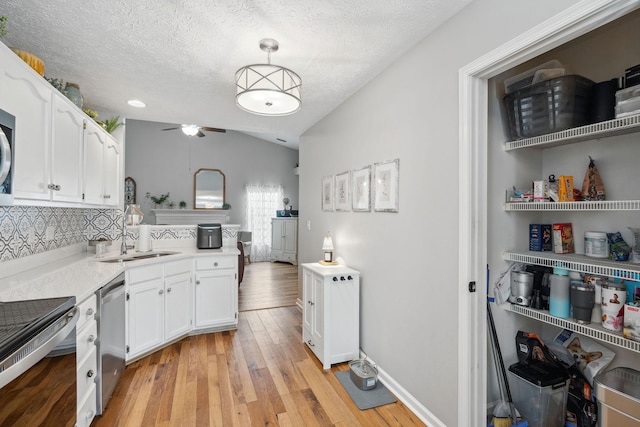 3207 Gardendale Dr, Franklin, TN 37064 - kitchen featuring stainless steel appliances, ceiling fan, white cabinetry, vaulted ceiling, and light countertops