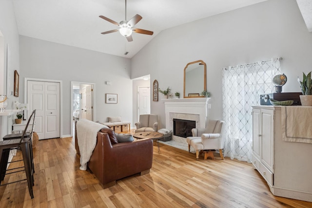 3207 Gardendale Dr, Franklin, TN 37064 - living room with high vaulted ceiling, light wood-style floors, a high end fireplace, and ceiling fan