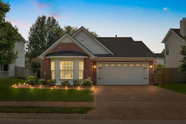 3207 Gardendale Dr, Franklin, TN 37064 - view of front of property featuring brick siding, driveway, a garage, and roof with shingles