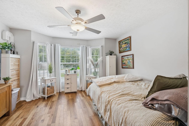 3207 Gardendale Dr, Franklin, TN 37064 - bedroom featuring light wood finished floors, a textured ceiling, and a ceiling fan