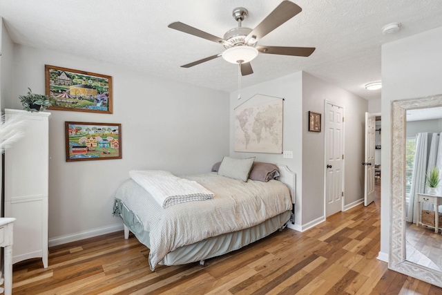 3207 Gardendale Dr, Franklin, TN 37064 - bedroom featuring light wood finished floors, baseboards, a ceiling fan, and a textured ceiling