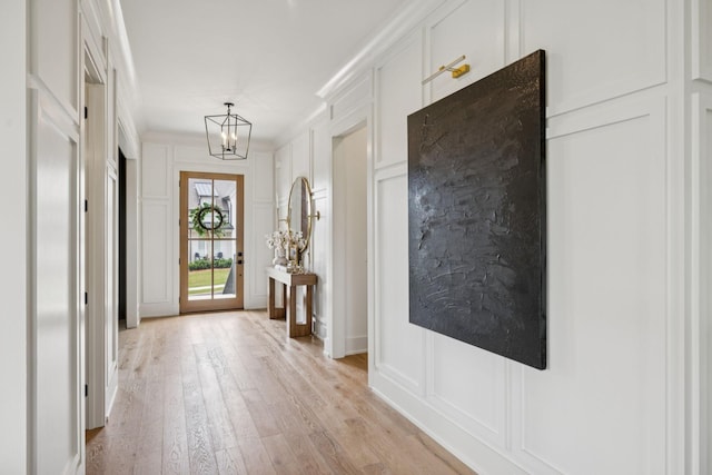 2764 Otterham Dr, Thompsons Station, TN 37179 - entrance foyer with a decorative wall, a chandelier, light wood-type flooring, and ornamental molding