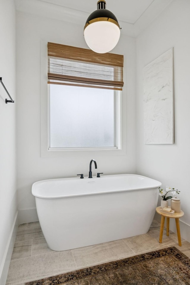 2764 Otterham Dr, Thompsons Station, TN 37179 - bathroom featuring a freestanding bath, baseboards, and tile patterned floors