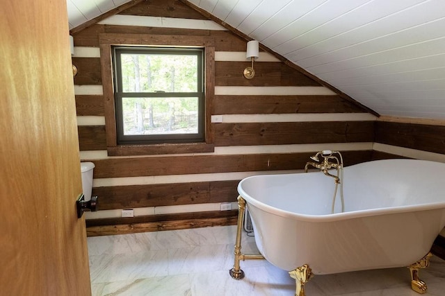 652 Northup Rd, Portland, TN 37148 - full bath featuring wood walls, vaulted ceiling, a freestanding tub, marble look tile flooring, and wood ceiling