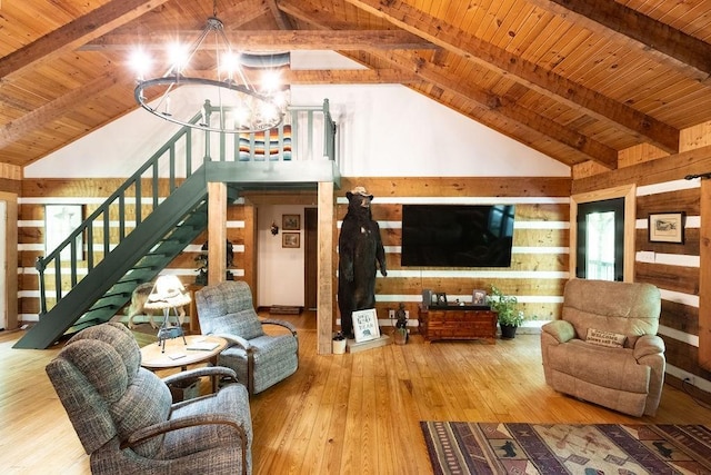 652 Northup Rd, Portland, TN 37148 - living room with wood ceiling with exposed beams, a chandelier, wood walls, stairway, and hardwood / wood-style floors