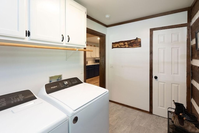 652 Northup Rd, Portland, TN 37148 - laundry area featuring cabinet space, washer and clothes dryer, and crown molding
