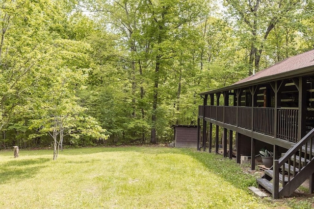 652 Northup Rd, Portland, TN 37148 - view of green lawn with stairway, a view of trees, and a wooden deck