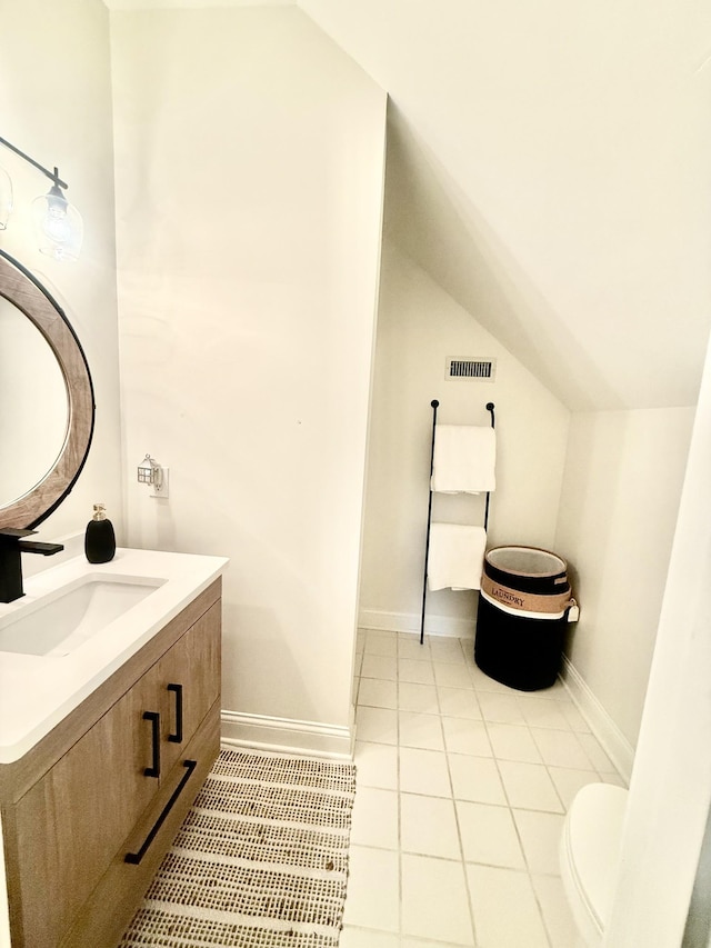 2815 Anglo Ct, Murfreesboro, TN 37129 - bathroom with vanity, tile patterned flooring, toilet, baseboards, and vaulted ceiling