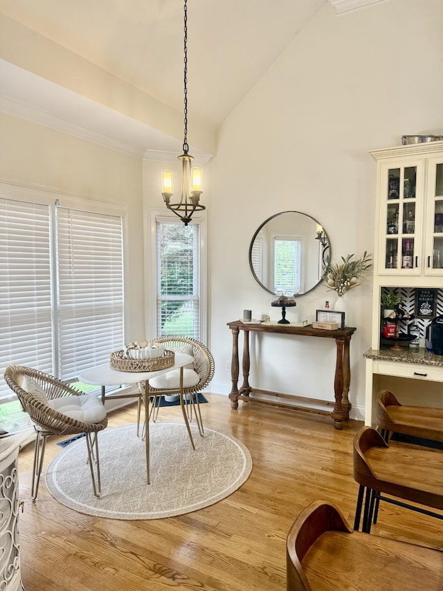 2815 Anglo Ct, Murfreesboro, TN 37129 - dining area featuring light wood-type flooring, baseboards, lofted ceiling, plenty of natural light, and a chandelier