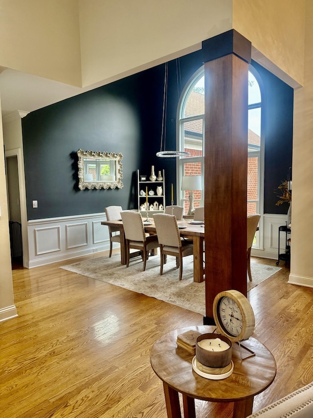 2815 Anglo Ct, Murfreesboro, TN 37129 - dining space with wood finished floors, a decorative wall, wainscoting, and a high ceiling