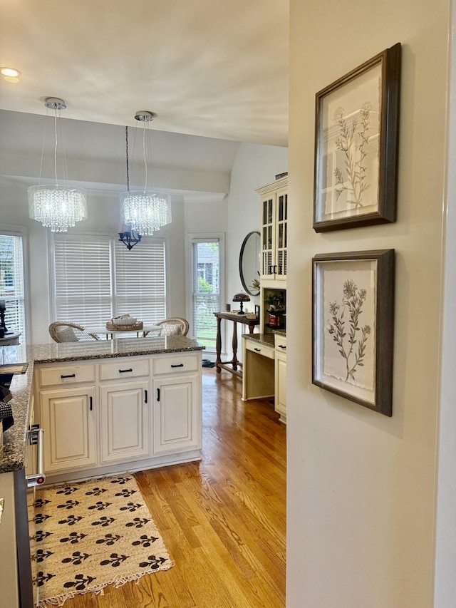 2815 Anglo Ct, Murfreesboro, TN 37129 - kitchen featuring light wood-type flooring, a chandelier, decorative light fixtures, white cabinetry, and dark stone counters