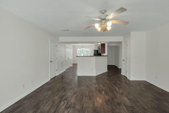 2013 Shaylin Loop, Antioch, TN 37013 - unfurnished living room with dark wood-type flooring, a ceiling fan, and baseboards