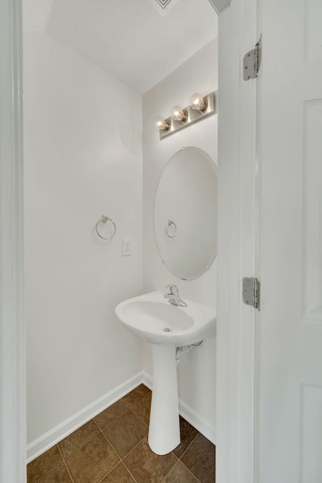 2013 Shaylin Loop, Antioch, TN 37013 - bathroom featuring baseboards, a sink, and tile patterned flooring