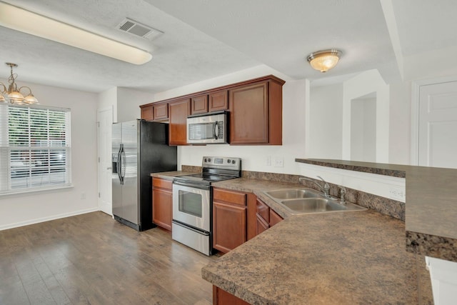 2013 Shaylin Loop, Antioch, TN 37013 - kitchen featuring stainless steel appliances, a sink, dark countertops, and dark wood-type flooring