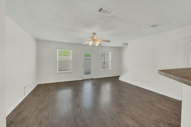 2013 Shaylin Loop, Antioch, TN 37013 - unfurnished living room with a ceiling fan, dark wood finished floors, baseboards, and a textured ceiling