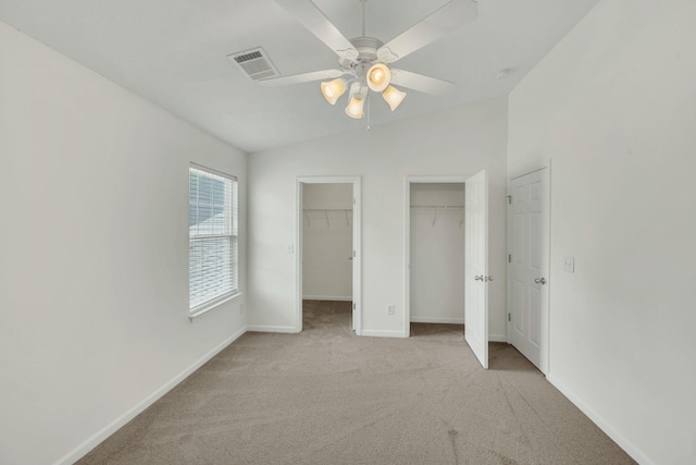 2013 Shaylin Loop, Antioch, TN 37013 - unfurnished bedroom with two closets, carpet, baseboards, lofted ceiling, and a ceiling fan