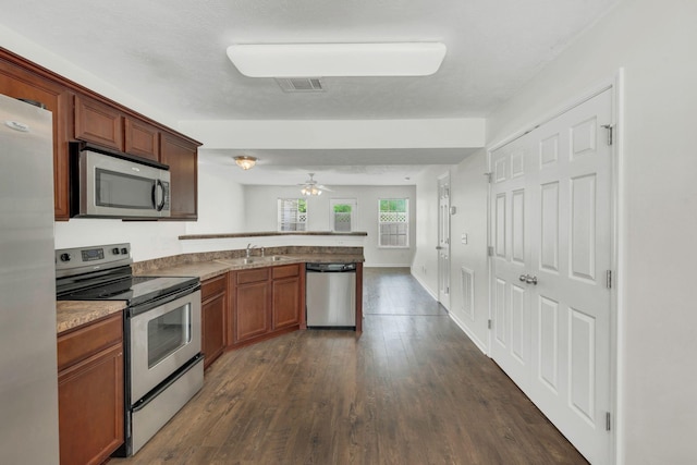 2013 Shaylin Loop, Antioch, TN 37013 - kitchen with stainless steel appliances, a peninsula, a sink, dark wood-style flooring, and ceiling fan