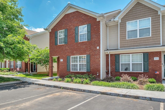 2013 Shaylin Loop, Antioch, TN 37013 - view of property with brick siding and uncovered parking