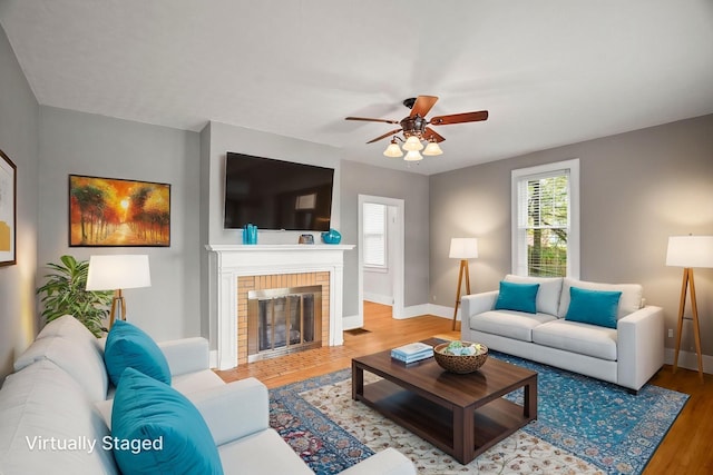 400 Connell St, Springfield, TN 37172 - living room with wood finished floors, baseboards, a ceiling fan, and a fireplace