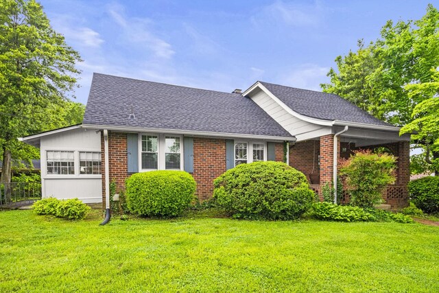 400 Connell St, Springfield, TN 37172 - view of front facade with a front lawn, a shingled roof, and brick siding