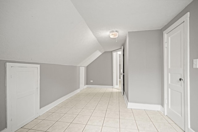 400 Connell St, Springfield, TN 37172 - additional living space with baseboards, light tile patterned floors, and vaulted ceiling