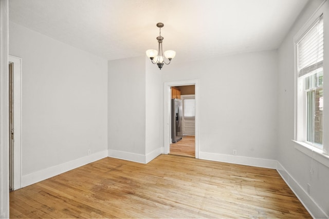 400 Connell St, Springfield, TN 37172 - spare room featuring a chandelier, light wood-style floors, and baseboards