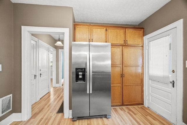 400 Connell St, Springfield, TN 37172 - kitchen featuring stainless steel fridge with ice dispenser, light wood-style flooring, and baseboards