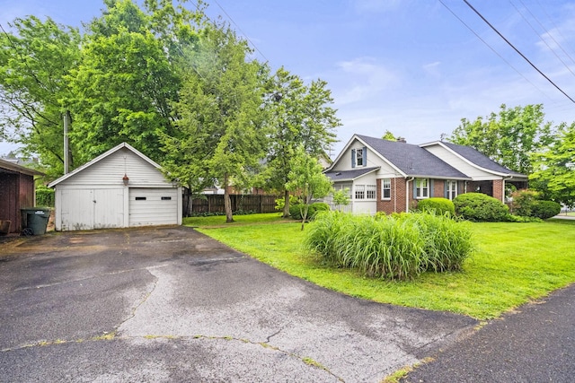 400 Connell St, Springfield, TN 37172 - view of side of property with a detached garage, brick siding, an outbuilding, and driveway