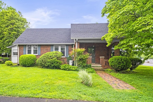 400 Connell St, Springfield, TN 37172 - view of front of house featuring brick siding, a front yard, and roof with shingles
