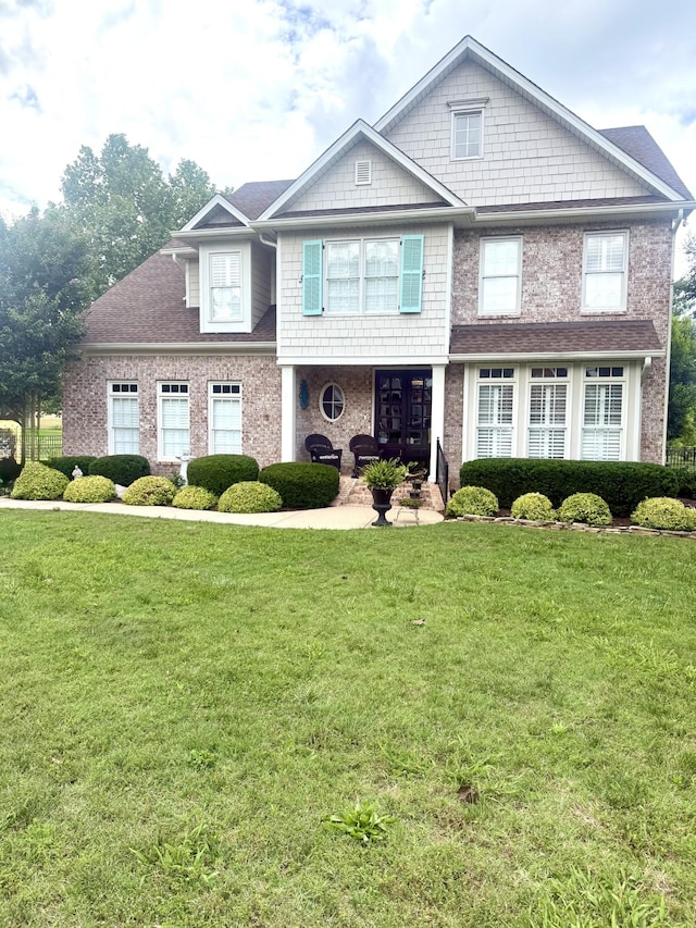 801 Peconic Pl, Murfreesboro, TN 37130 - view of front of property with a front yard, a porch, and brick siding