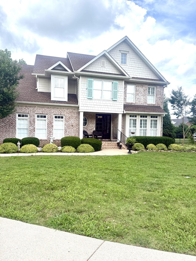 801 Peconic Pl, Murfreesboro, TN 37130 - view of front of home with a front yard, brick siding, and covered porch