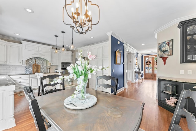 801 Peconic Pl, Murfreesboro, TN 37130 - dining space with light wood-style floors, a chandelier, crown molding, and recessed lighting
