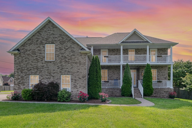 300 Remington Ave, Gallatin, TN 37066 - view of front of property with a balcony, a front yard, covered porch, and brick siding