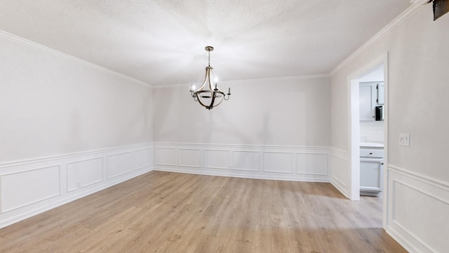 1280 Middle Tennessee Blvd Unit D6, Murfreesboro, TN 37130 - unfurnished room with a chandelier, light wood finished floors, wainscoting, ornamental molding, and a decorative wall