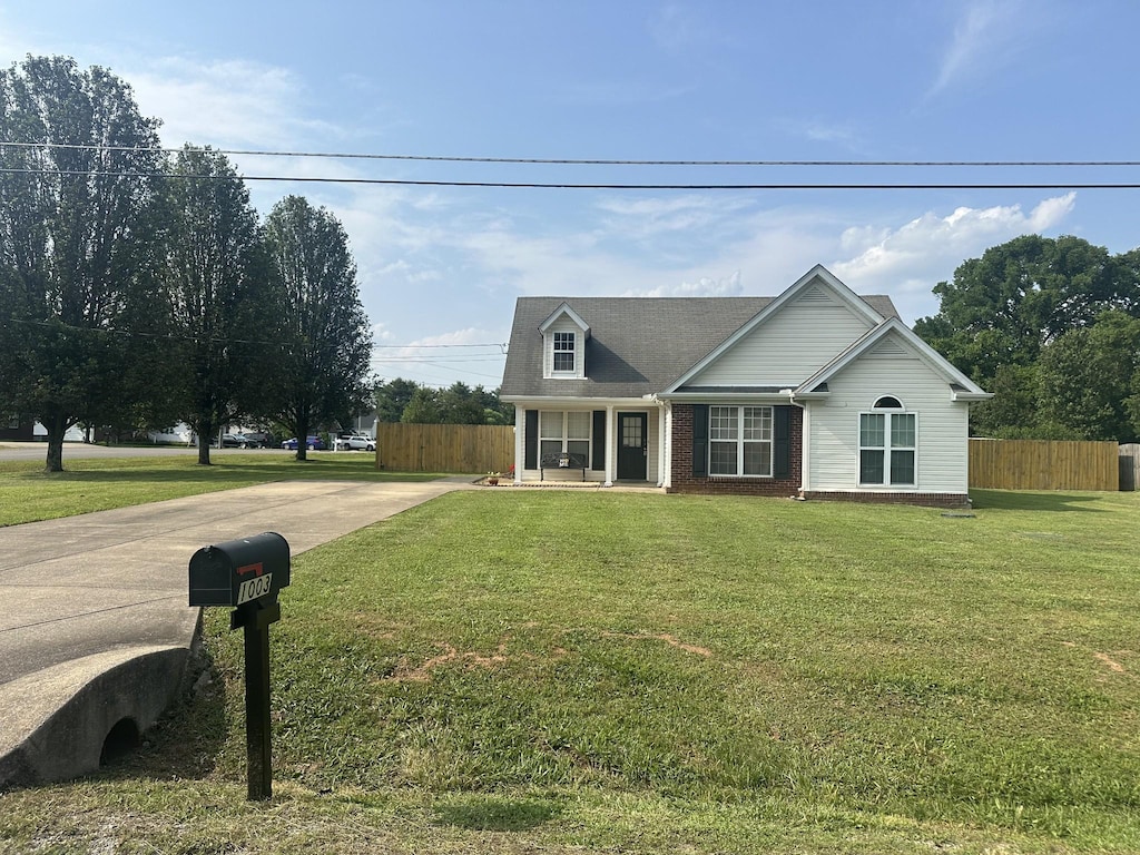 1003 Herron St, Murfreesboro, TN 37130 - view of front of property with concrete driveway, a porch, and brick siding