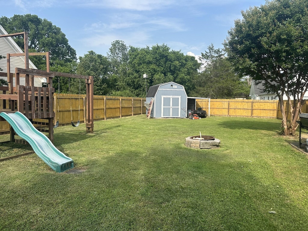 1003 Herron St, Murfreesboro, TN 37130 - view of yard with a fire pit, a playground, and view of scattered trees