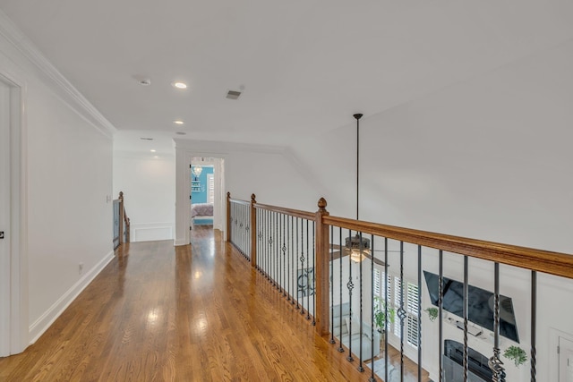 1918 Mosaic Trl, Murfreesboro, TN 37130 - hall featuring wood finished floors, crown molding, recessed lighting, an upstairs landing, and baseboards