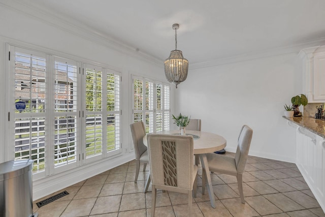 1918 Mosaic Trl, Murfreesboro, TN 37130 - dining room featuring a chandelier, plenty of natural light, light tile patterned floors, and ornamental molding