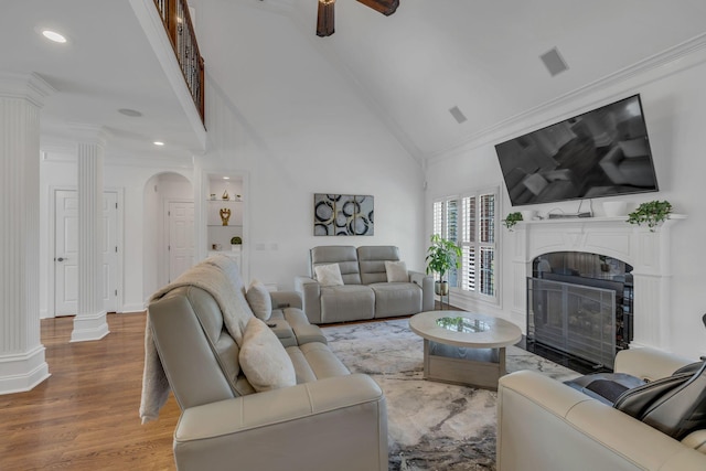1918 Mosaic Trl, Murfreesboro, TN 37130 - living area with ornate columns, a premium fireplace, wood finished floors, ornamental molding, and a high ceiling