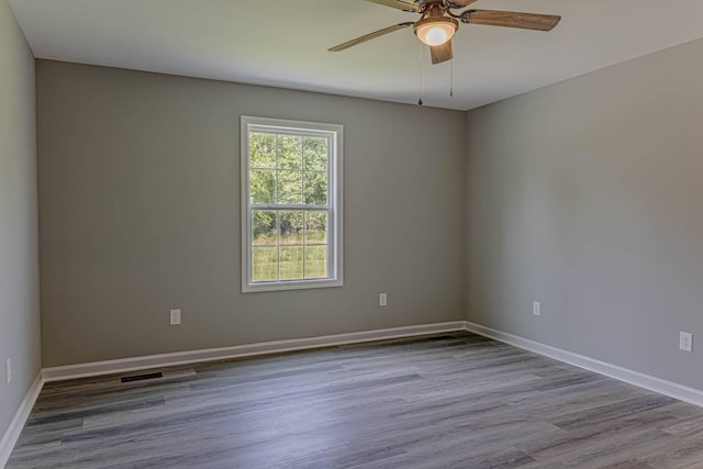 259 Longbranch Rd, Hohenwald, TN 38462 - empty room featuring wood finished floors, ceiling fan, and baseboards