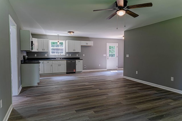 259 Longbranch Rd, Hohenwald, TN 38462 - kitchen with dishwasher, dark countertops, stove, and baseboards