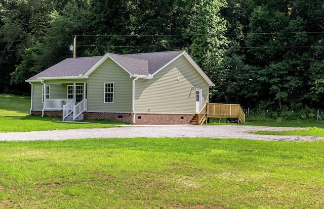 259 Longbranch Rd, Hohenwald, TN 38462 - view of front of property featuring crawl space, stairway, covered porch, a front lawn, and roof with shingles