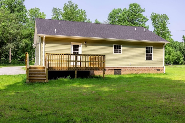 259 Longbranch Rd, Hohenwald, TN 38462 - rear view of house featuring a deck, a lawn, crawl space, and roof with shingles