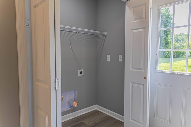 259 Longbranch Rd, Hohenwald, TN 38462 - laundry area with hookup for an electric dryer, healthy amount of natural light, dark wood-style floors, and baseboards